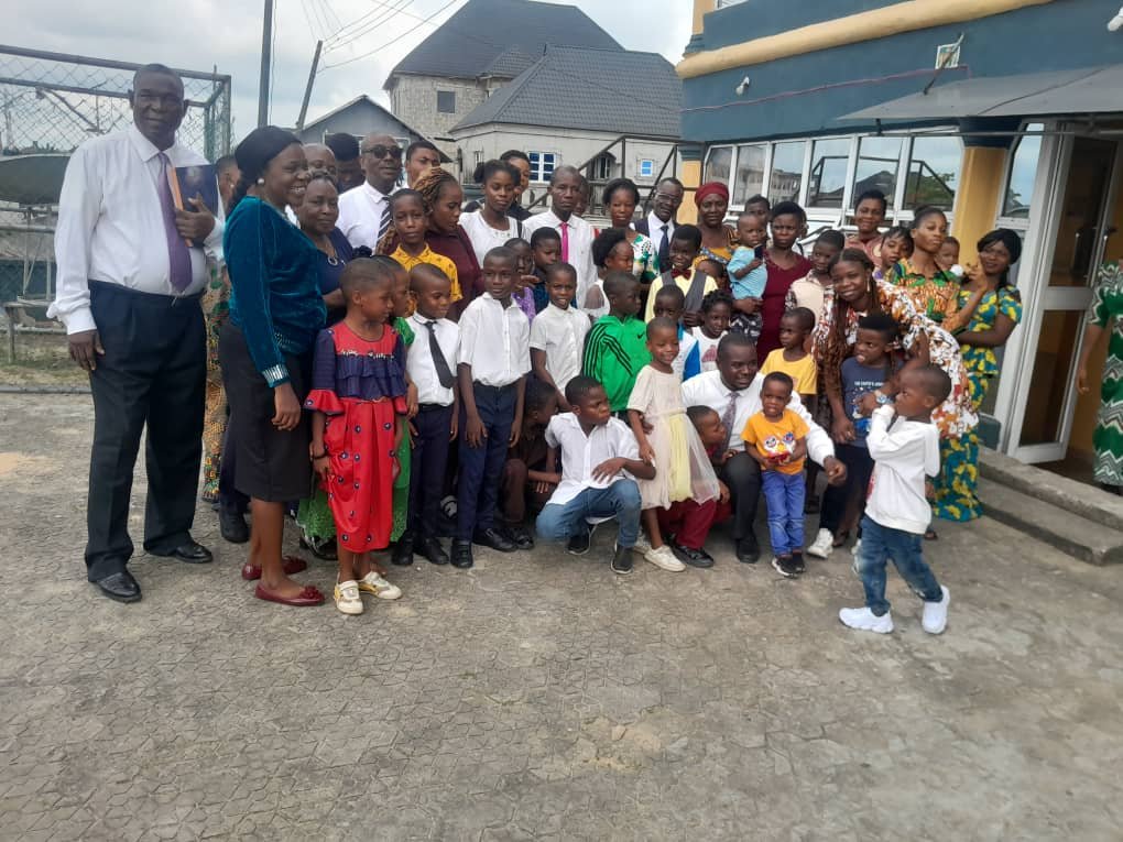 Church members posing together with their children