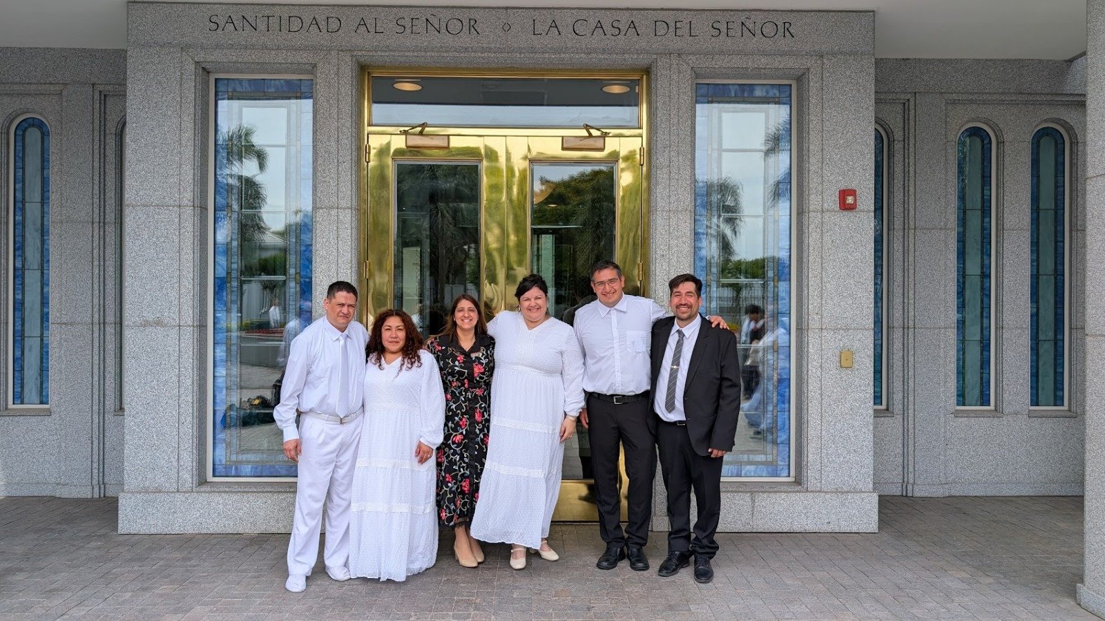 Happy families embracing and celebrating after their temple sealing ceremony