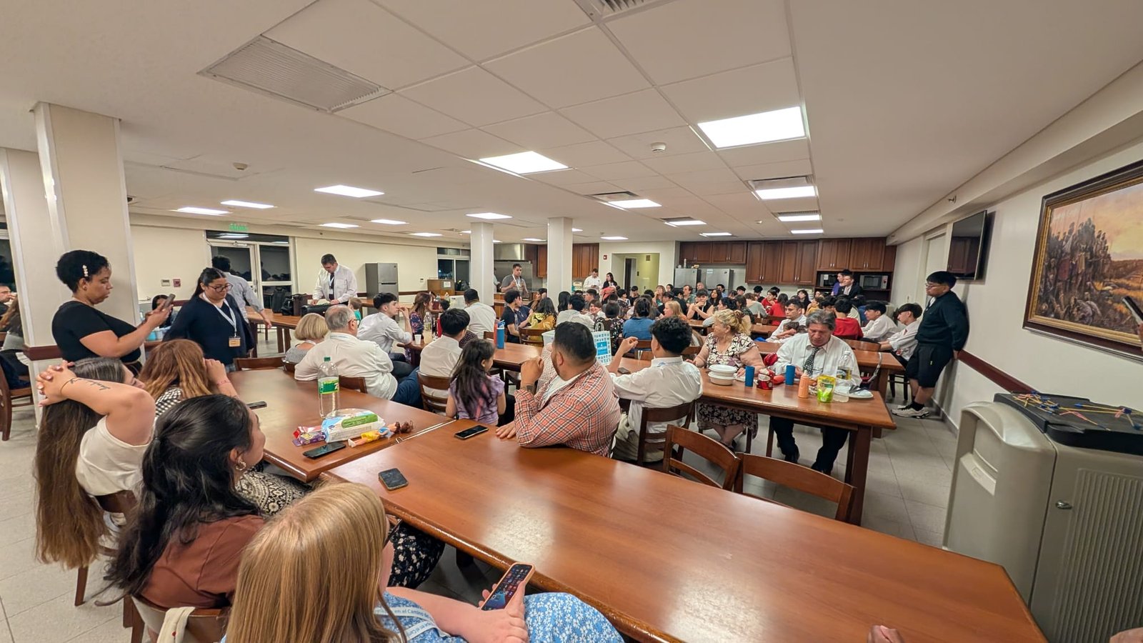 Additional members bearing testimony during the devotional gathering