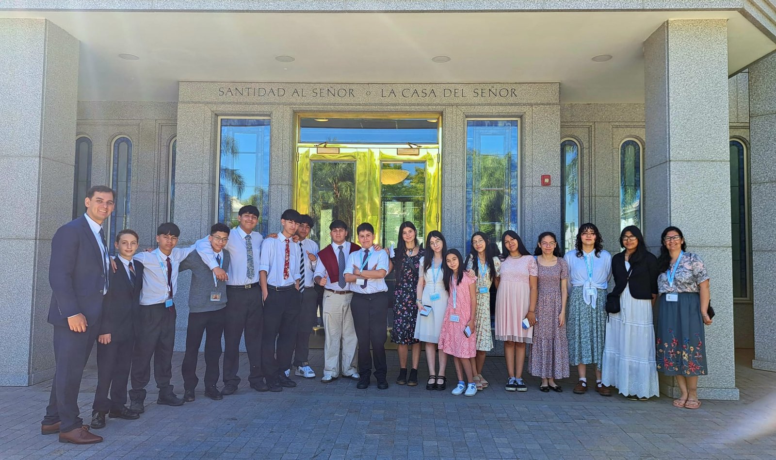 Youth smiling together after participating in a temple baptism session